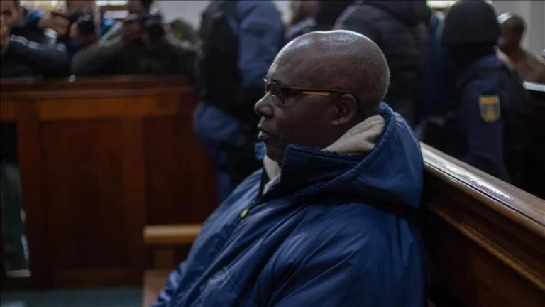 Kayishema, a Rwandan genocide suspect, stands in court in South Africa.