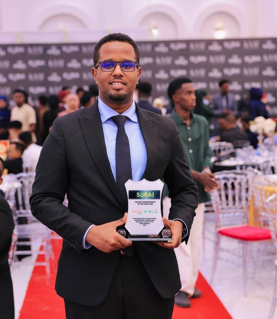 Member of the Hayat Market delegation display the award during the gala. Photo: Supplied